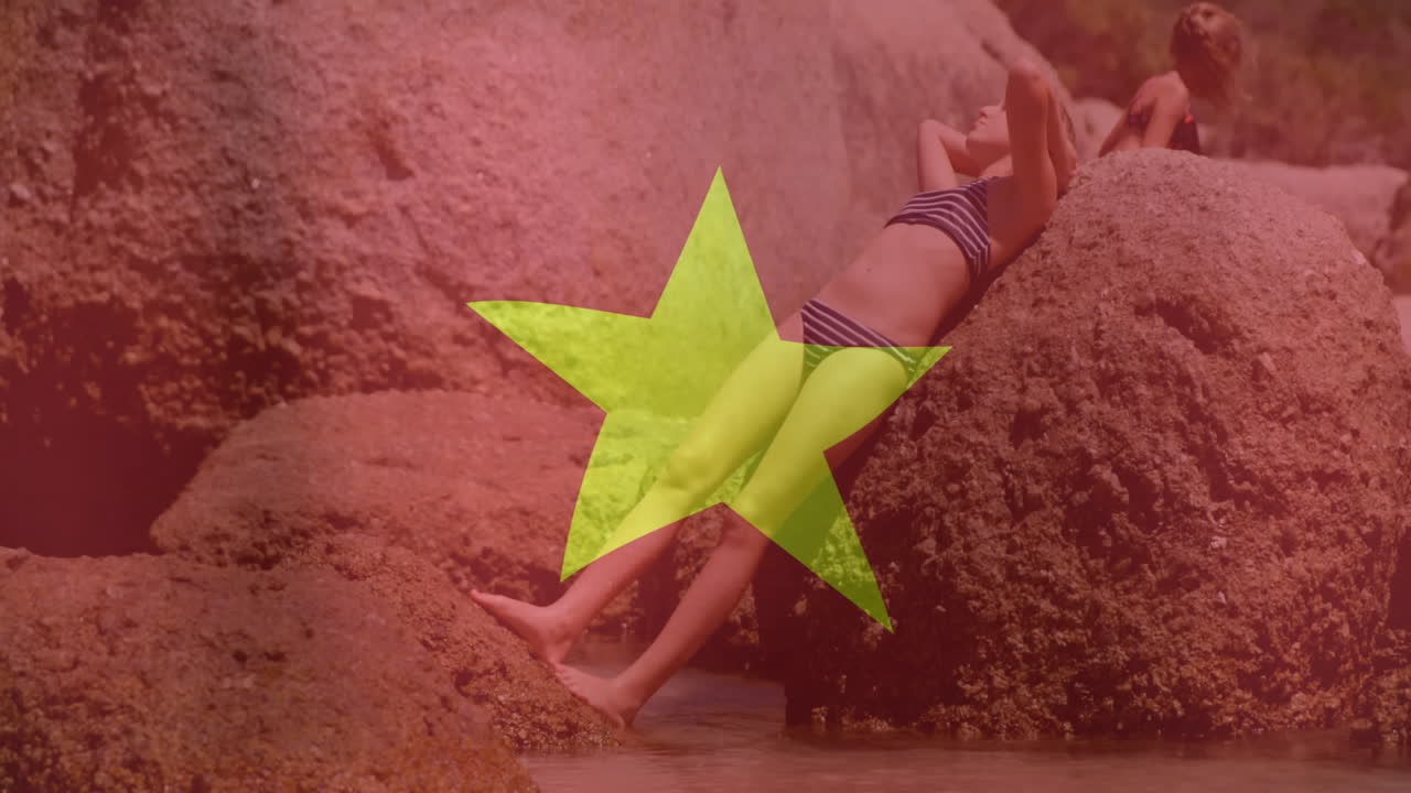 Relaxing on rocky beach, person with large yellow star and animation overlay