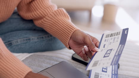 Plane-ticket,-hands-and-laptop-with-information