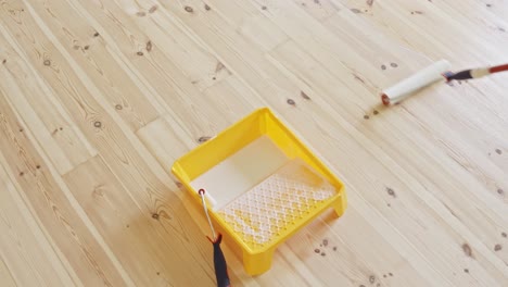varnishing hardwood floor with a roller, diy renovation project