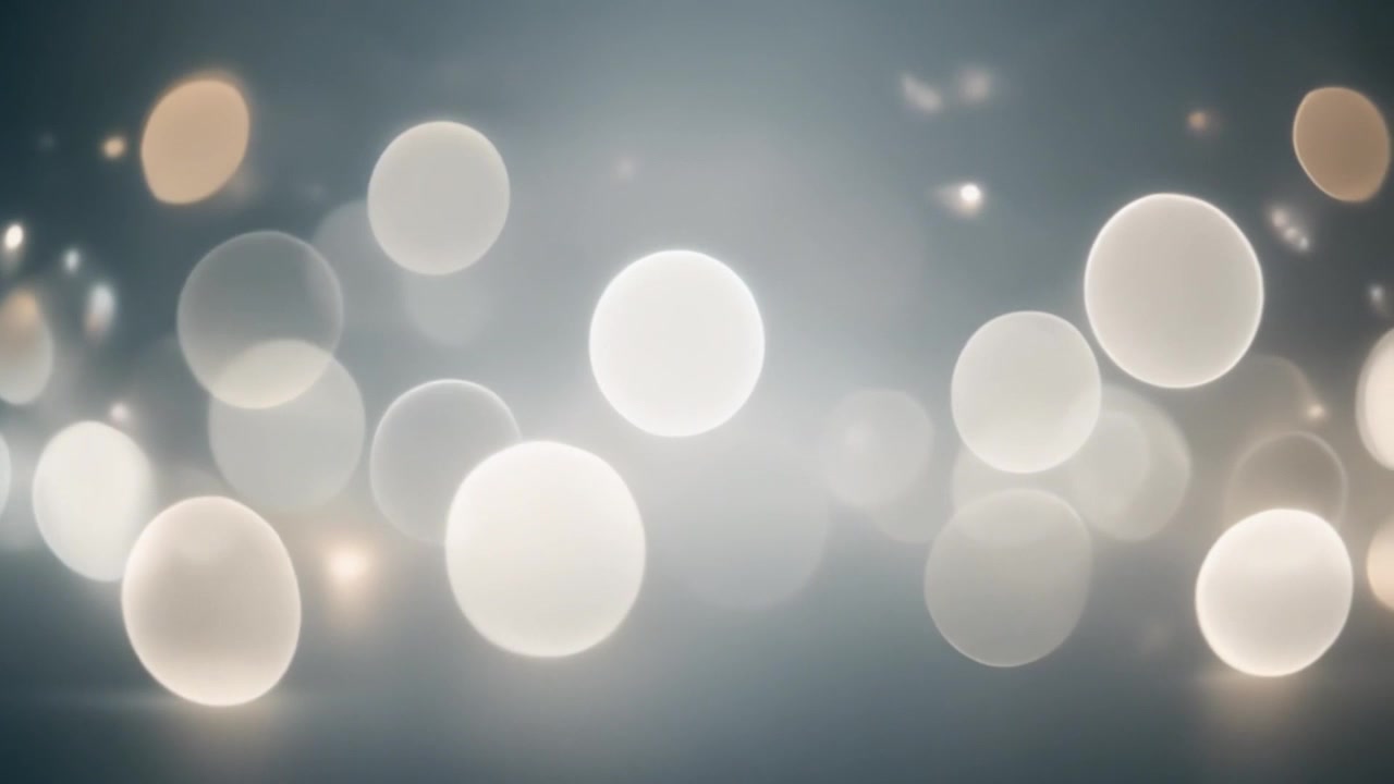 Abstrakt baggrund med bløde hvide glødende bokeh-lys.