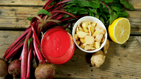 various ingredients with juice on wooden table 4k