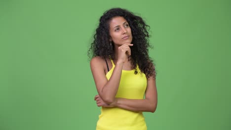 young beautiful hispanic woman thinking