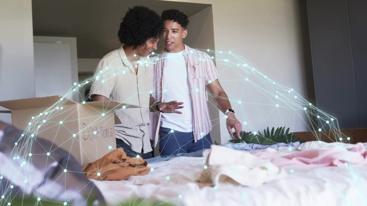 Two men sorting clothes on bed after spotting donations box to donate, animated tags marking picks