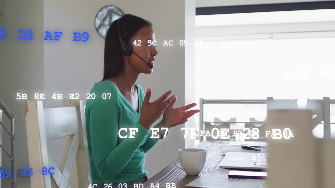 Vertical video: Woman on cue, speaking, gesturing to laptop while hex overlaying view for business