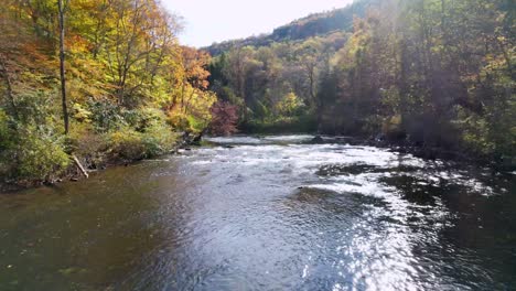 low fast aerial push into the new river in watauga county nc, north carolina near boone