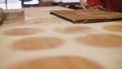 bakery removing oven plates from table