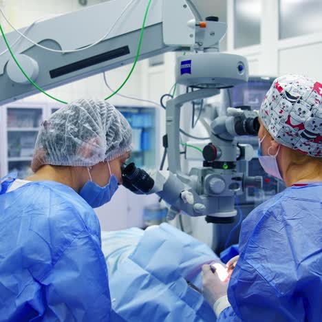 surgeons holding medical instruments