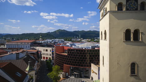 Panorama-Motion-Time-Lapse-of-Žilina-City,-Slovakia-viewed-from-Burian's-Tower-on-summer-sunny-day