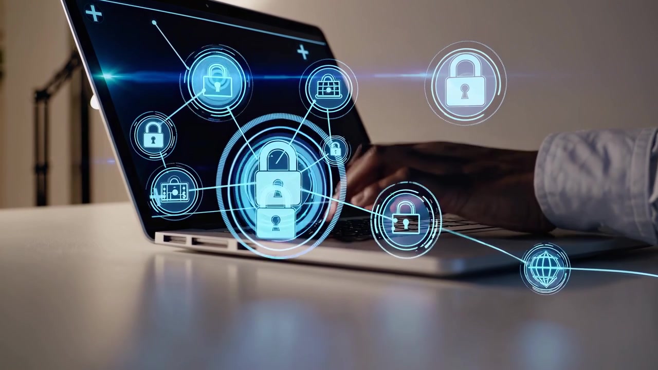 Person Typing on Laptop with Cybersecurity and Data Protection Icons