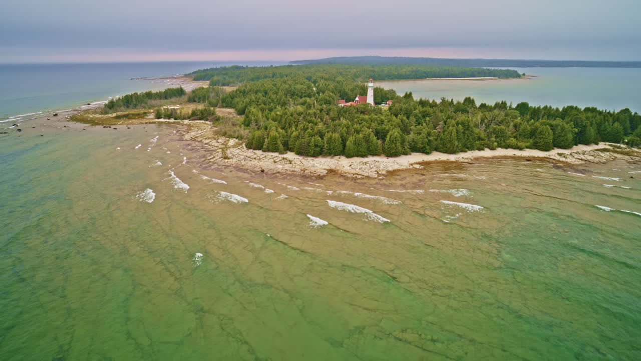 Aerial View of a Lighthouse on a Secluded Island