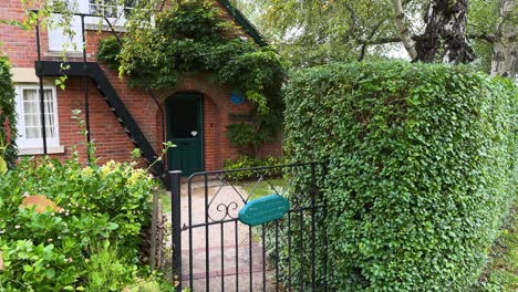 entrance gate of cs lewis house with greenery in risinghurst, oxford, england