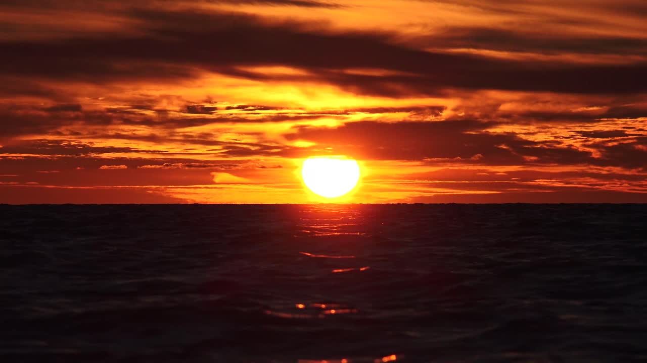 Sunset, when the path of the sunlight through the atmosphere to the eye is longest, the blue and green components are removed almost completely, leaving the longer wavelength orange and red light