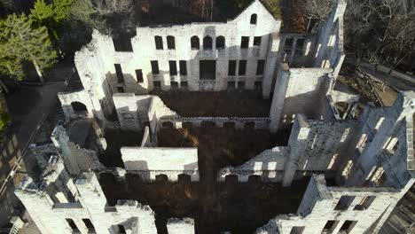 european historical medieval stone castle ruins, aerial establishing