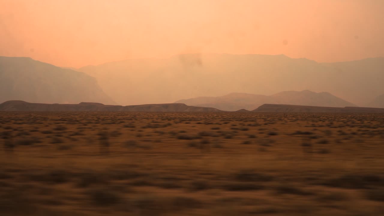 Warm desert terrain in the western United States as seen from an RV window in late August of 2020.