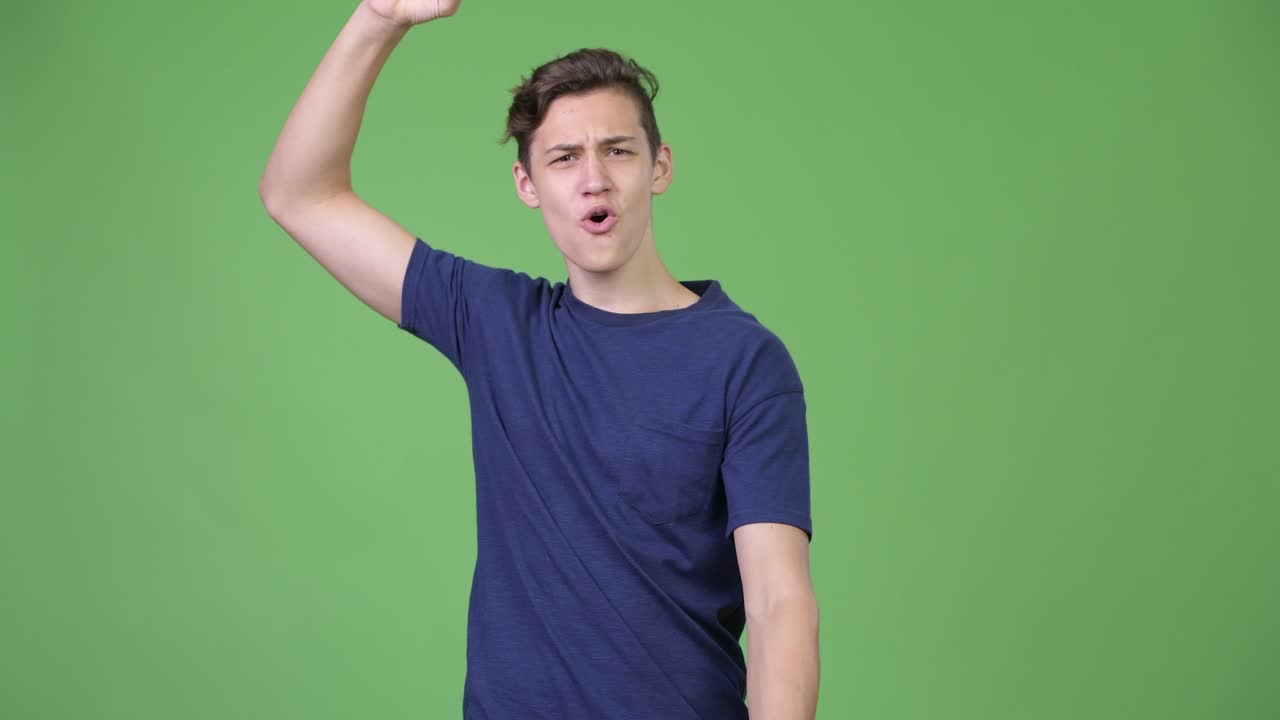 Young handsome teenage boy playing games