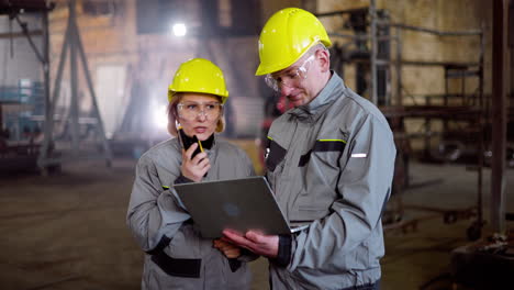 two co-workers talking at work