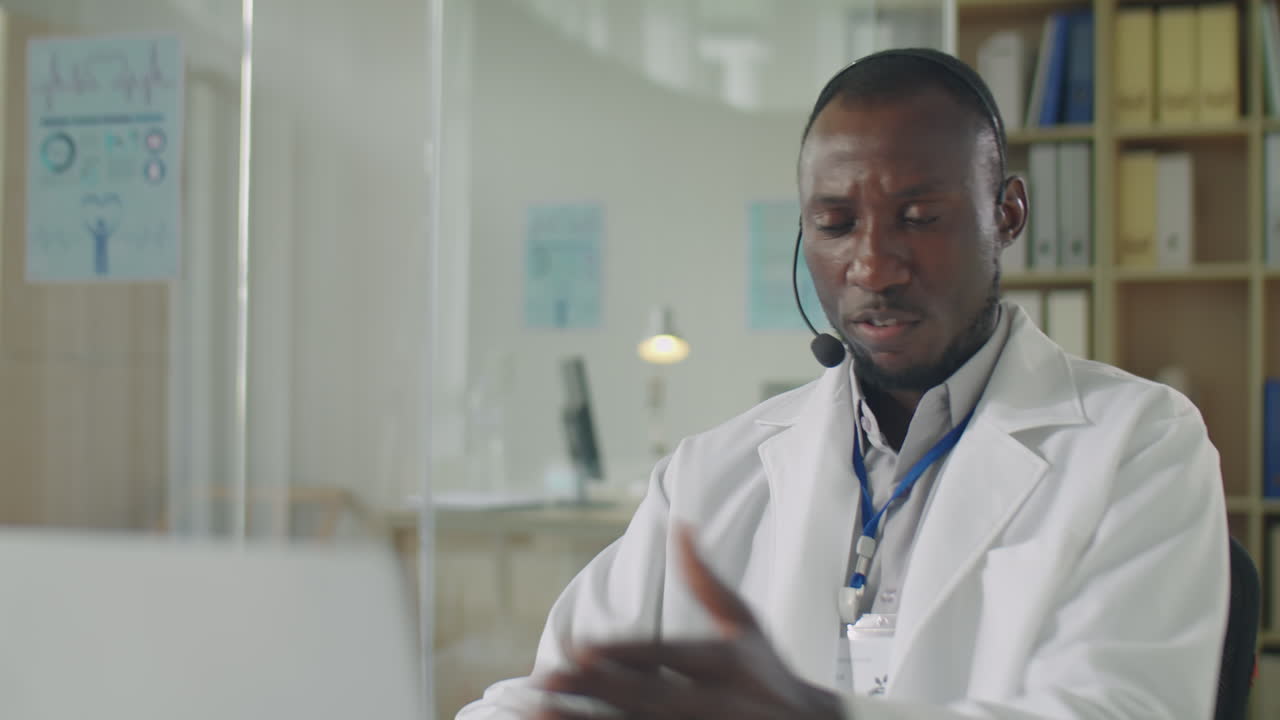Black Doctor Giving Online Consultation on Video Call