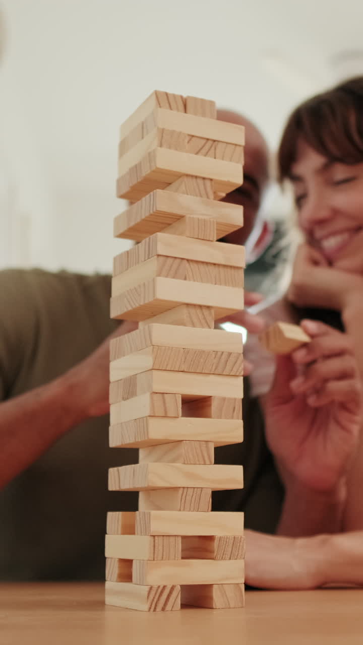 partners Playing Jenga at Home