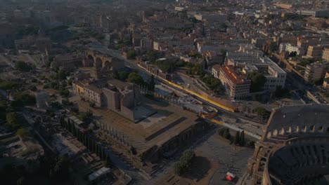 City-colosseum,-Aerial-view-of-roman-city-during-the-morning