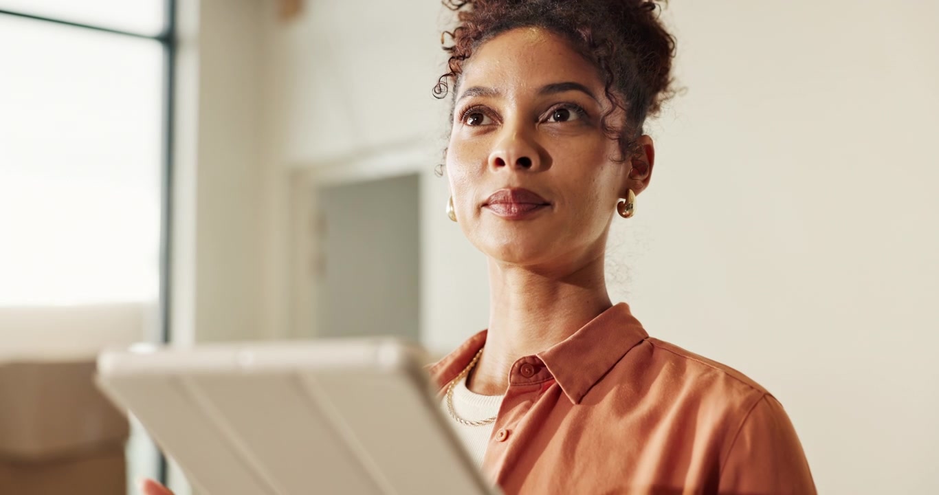 Professional Woman Using Tablet in Modern Office Setting