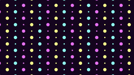 colorful dot pattern on dark background purple, yellow, and blue circles