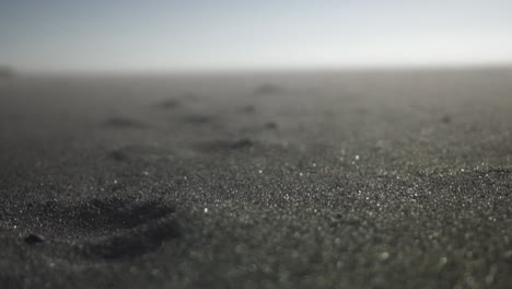 close-up of sand going across the beach floor