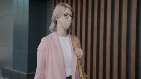 woman wearing mask walking outdoors