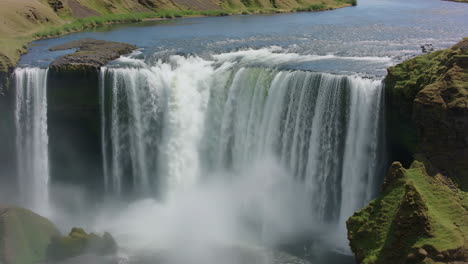 majestic waterfall in a green landscape