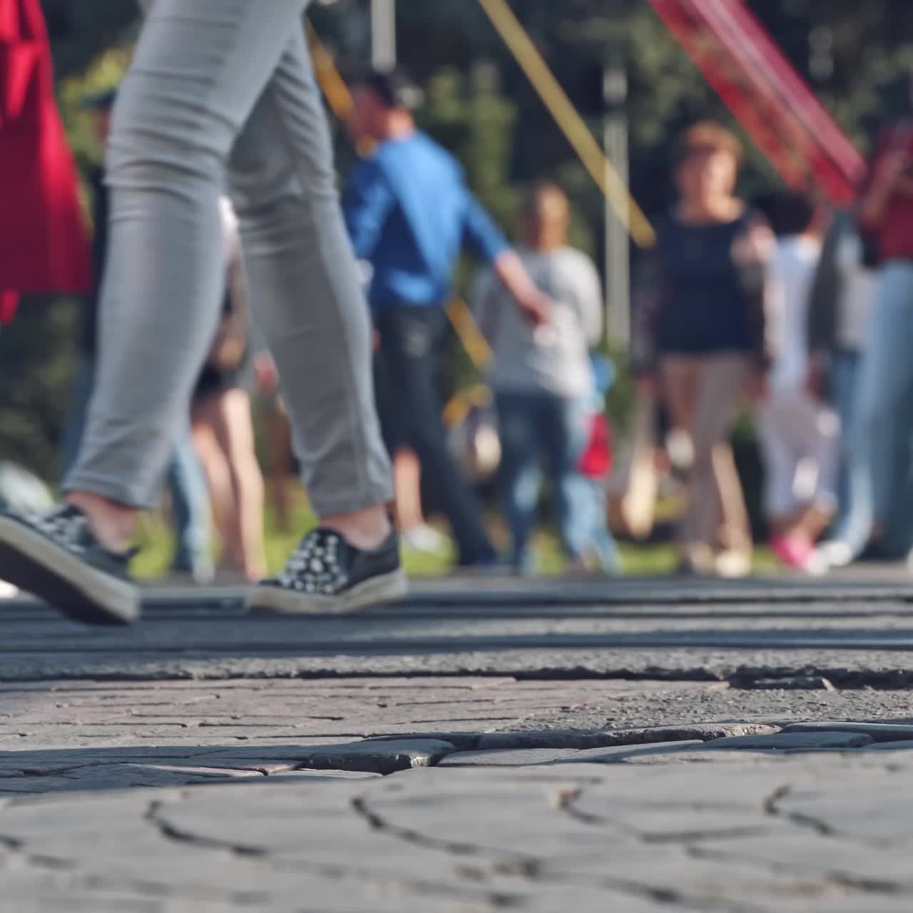 Crowd walking on sidewalk
