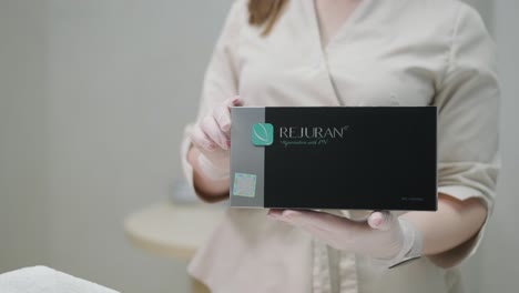 woman making botulinum therapy in modern cosmetology clinic close up. professional cosmetologist doing injection with botulinum toxin for rejuvenation face skin. attractive lady patient smoothing wrinkles.