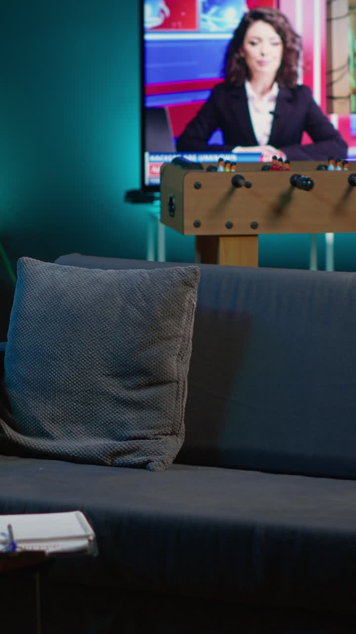 Empty Living Room with News Broadcast on Television Screen