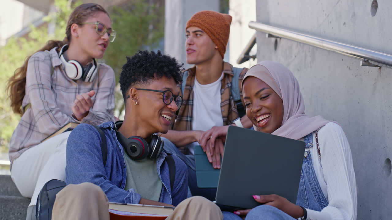 Group of diverse students studying together outdoors