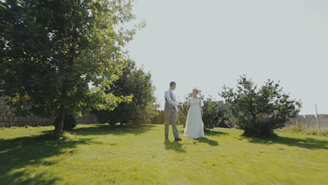 Wedding couple running around an old castle. Walking in the open air