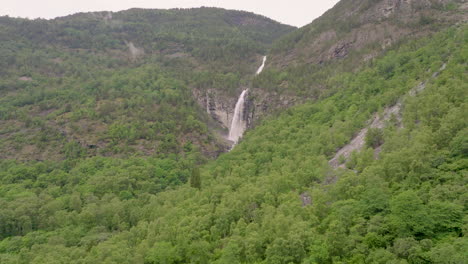 stodnafossen waterfall in norway, beautiful aerial drone, lush green