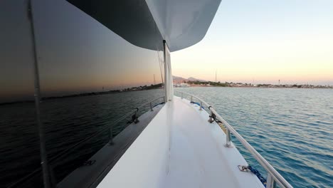 A-Luxurious-Yacht-Sailing-in-the-Waters-of-the-Red-Sea-in-Dahab,-Sinai-Peninsula,-Egypt---Drone-Flying-Forward