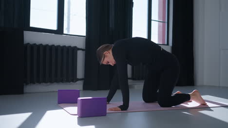 woman doing yoga in a studio