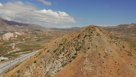 american flag on top of a hill near highway 15 near phelan, california