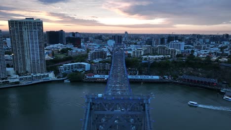 Drone-shot-of-Story-Bridge,-camera-orbiting-Howard-Smith-Wharves-with-Story-bridge-in-foreground