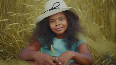 smiling girl in a wheat field