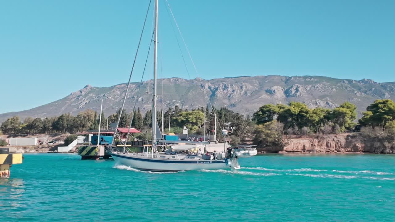 Yacht crossing Corinth canal submersible road bridge