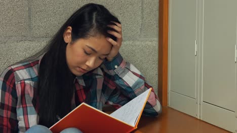 Student-reading-her-school-book