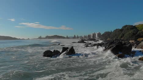 AERIAL-SLOW-MOTION:-Waves-breaking-over-rocks-clip-7