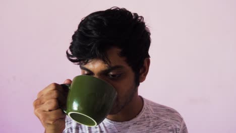 man drinking bad coffee and spitting coffee