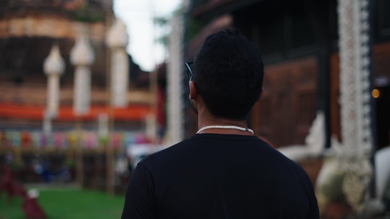 Man Visiting a Temple in Thailand
