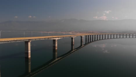 low aerial shot of long lake bridge with