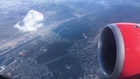 turbine view from an airplane flying above a city, landscape europe