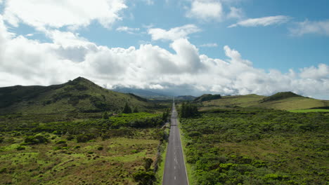 forwards fly above road leading through countryside