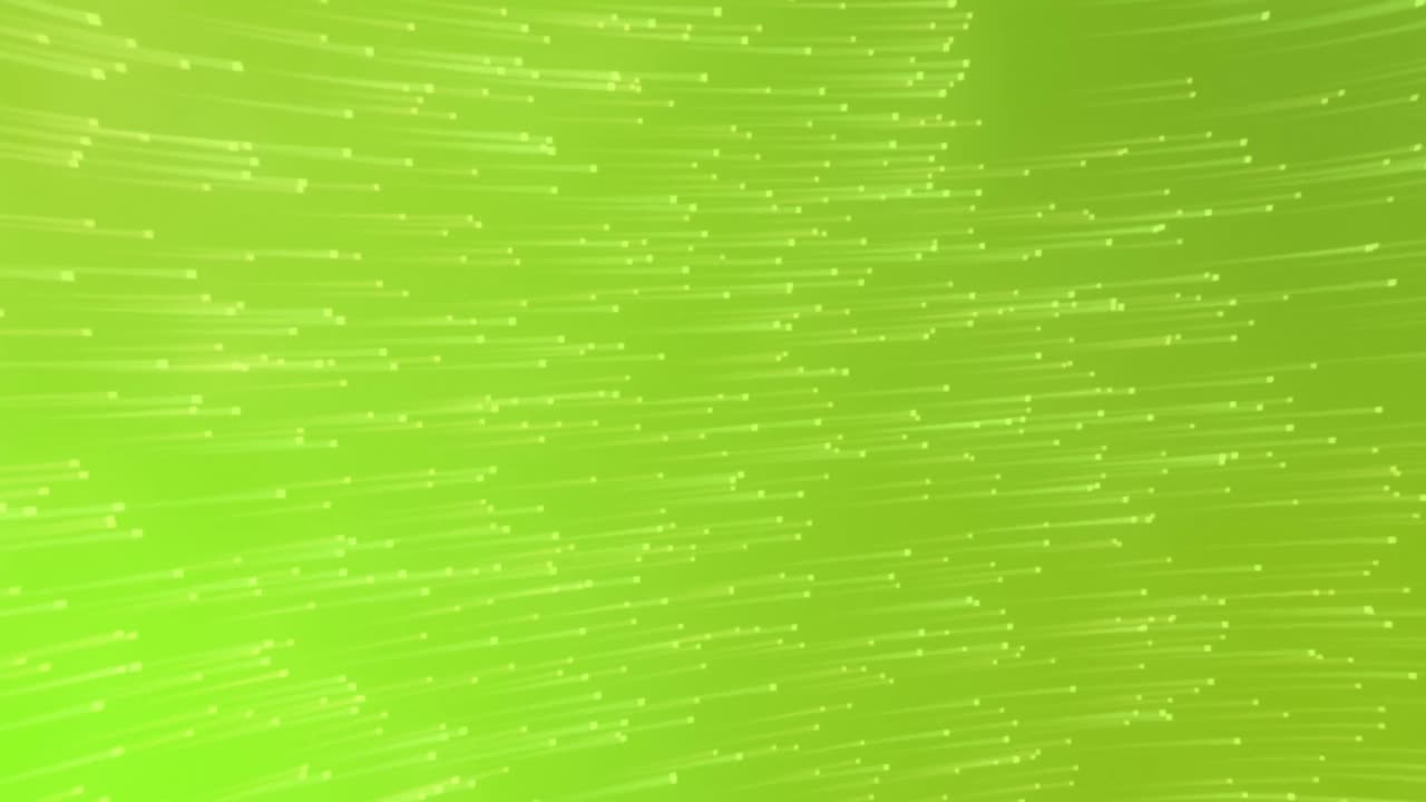 Animation of multiple green light trails moving in hypnotic motion in background