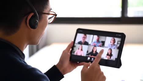 man on multi-person video conference call
