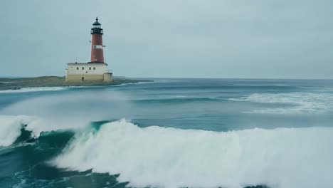 lighthouse on a rocky coast with stormy waves